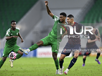 Lucas Verissimo of Al Duhail FC battles for the ball with Sekou Oumar Yansane of Al Ahli SC during the Ooredoo Qatar Stars League 24/25 matc...