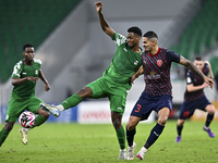 Lucas Verissimo of Al Duhail FC battles for the ball with Sekou Oumar Yansane of Al Ahli SC during the Ooredoo Qatar Stars League 24/25 matc...