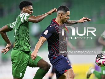 Lucas Verissimo of Al Duhail FC battles for the ball with Sekou Oumar Yansane of Al Ahli SC during the Ooredoo Qatar Stars League 24/25 matc...