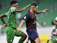 Lucas Verissimo of Al Duhail FC battles for the ball with Sekou Oumar Yansane of Al Ahli SC during the Ooredoo Qatar Stars League 24/25 matc...