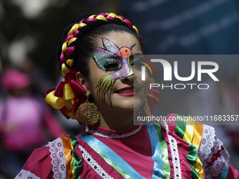 Regional dance takes place during the parade of monumental alebrijes in Mexico City, Mexico, on October 19, 2024, from the Zocalo to Paseo d...