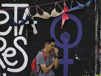 A person stands in front of a clothesline of bras at the Glorieta de las Mujeres que Luchan in Mexico City, Mexico, on October 19, 2024. Thi...