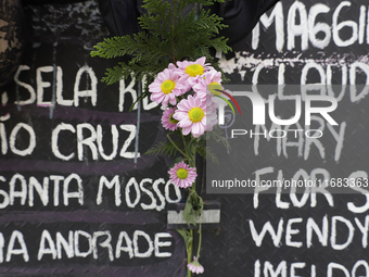 View of flowers on a clothesline of bras at the Glorieta de las Mujeres que Luchan in Mexico City, Mexico, on October 19, 2024, placed by wo...