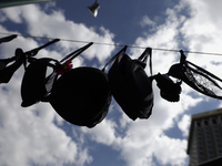 A clothesline of bras is placed at the Glorieta de las Mujeres que Luchan in Mexico City, Mexico, on October 19, 2024, by women who survive...