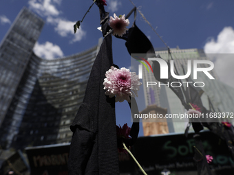 View of flowers on a clothesline of bras at the Glorieta de las Mujeres que Luchan in Mexico City, Mexico, on October 19, 2024, placed by wo...