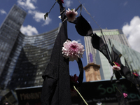 View of flowers on a clothesline of bras at the Glorieta de las Mujeres que Luchan in Mexico City, Mexico, on October 19, 2024, placed by wo...