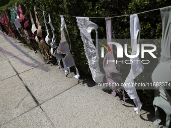 A clothesline of bras is placed at the Glorieta de las Mujeres que Luchan in Mexico City, Mexico, on October 19, 2024, by women who survive...