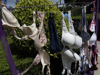 A clothesline of bras is placed at the Glorieta de las Mujeres que Luchan in Mexico City, Mexico, on October 19, 2024, by women who survive...