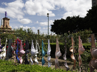 A clothesline of bras is placed at the Glorieta de las Mujeres que Luchan in Mexico City, Mexico, on October 19, 2024, by women who survive...