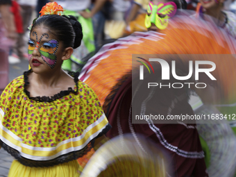 Regional dance takes place during the parade of monumental alebrijes in Mexico City, Mexico, on October 19, 2024, from the Zocalo to Paseo d...