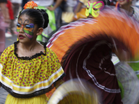 Regional dance takes place during the parade of monumental alebrijes in Mexico City, Mexico, on October 19, 2024, from the Zocalo to Paseo d...