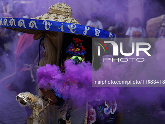 Regional dance takes place during the parade of monumental alebrijes in Mexico City, Mexico, on October 19, 2024, from the Zocalo to Paseo d...