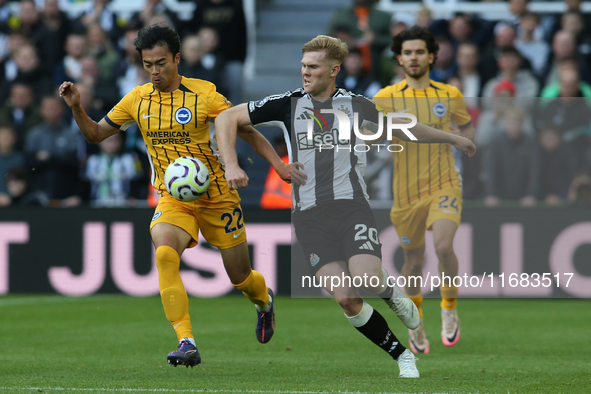 Kaoru Mitoma of Brighton and Hove Albion takes on Lewis Hall of Newcastle United during the Premier League match between Newcastle United an...