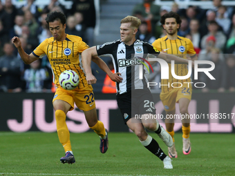 Kaoru Mitoma of Brighton and Hove Albion takes on Lewis Hall of Newcastle United during the Premier League match between Newcastle United an...