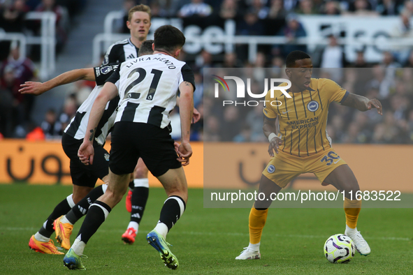 Pervis Estupinan is under pressure during the Premier League match between Newcastle United and Brighton and Hove Albion at St. James's Park...