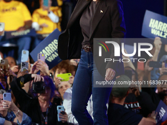 Waterford, MICHIGAN - OCTOBER 18: US Vice President and Democratic presidential candidate Kamala Harris enters the Oakland County campaign r...