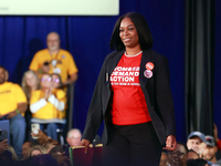 Waterford, MICHIGAN - OCTOBER 18: Michigan Moms Demand Action volunteer and gun violence survivor Mia Reid walks onto the stage to speak and...