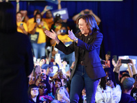 Waterford, MICHIGAN - OCTOBER 18: US Vice President and Democratic presidential candidate Kamala Harris walks onto the stage at the Oakland...