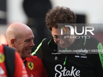 Mattia Binotto speaks to an old colleague as he arrives at Circuit of the Americas in Austin, Texas, on October 19, 2024, during the Formula...