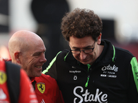 Mattia Binotto speaks to an old colleague as he arrives at Circuit of the Americas in Austin, Texas, on October 19, 2024, during the Formula...