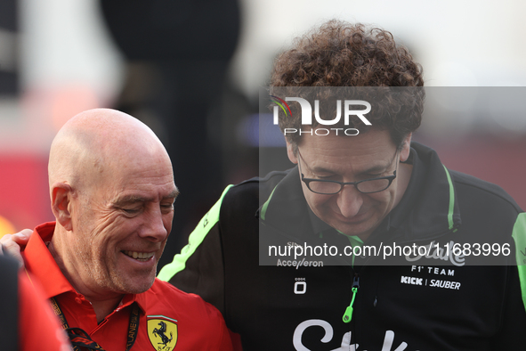 Mattia Binotto speaks to an old colleague as he arrives at Circuit of the Americas in Austin, Texas, on October 19, 2024, during the Formula...