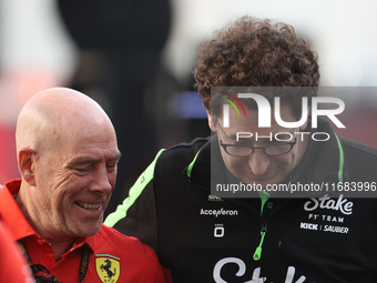 Mattia Binotto speaks to an old colleague as he arrives at Circuit of the Americas in Austin, Texas, on October 19, 2024, during the Formula...