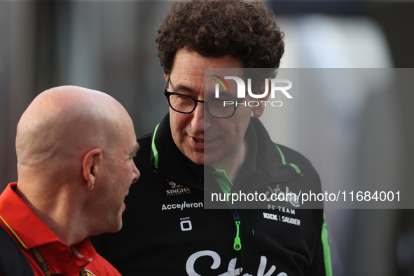 Mattia Binotto speaks to an old colleague as he arrives at Circuit of the Americas in Austin, Texas, on October 19, 2024, during the Formula...