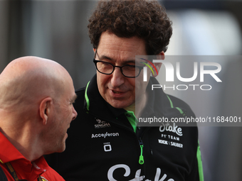 Mattia Binotto speaks to an old colleague as he arrives at Circuit of the Americas in Austin, Texas, on October 19, 2024, during the Formula...