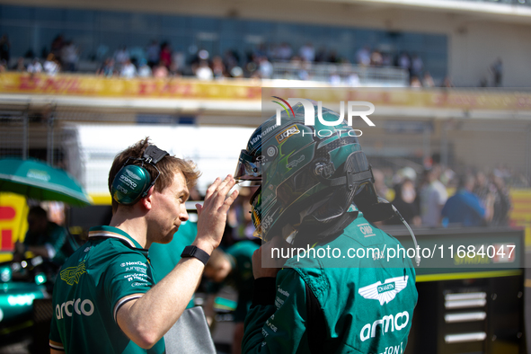 Lance Stroll secures his helmet ahead of a sprint race at Circuit of the Americas in Austin, Texas, on October 19, 2024, during the Formula...