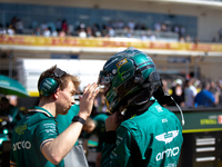 Lance Stroll secures his helmet ahead of a sprint race at Circuit of the Americas in Austin, Texas, on October 19, 2024, during the Formula...