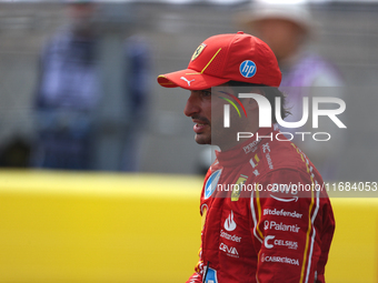 Carlos Sainz waves to fans after driving in a sprint race at Circuit of the Americas in Austin, Texas, on October 19, 2024, during the Formu...