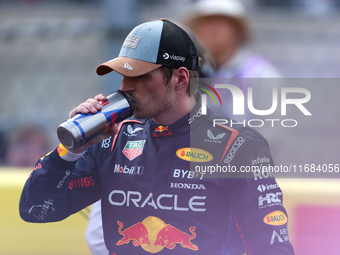 Max Verstappen hydrates following a sprint race at Circuit of the Americas in Austin, Texas, on October 19, 2024, during the Formula 1 Pirel...