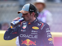 Max Verstappen hydrates following a sprint race at Circuit of the Americas in Austin, Texas, on October 19, 2024, during the Formula 1 Pirel...