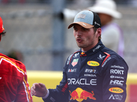 Carlos Sainz and Max Verstappen speak after finishing a sprint race at Circuit of the Americas in Austin, Texas, on October 19, 2024, during...