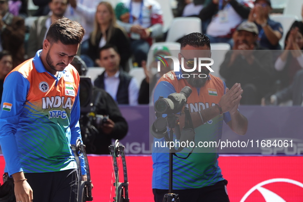 Prathamesh Balchandra Fuge of India competes against Priyansh of India (not in picture) during the quarterfinals match on the second day of...