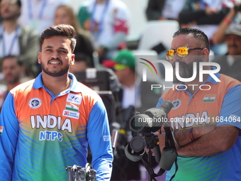 Prathamesh Balchandra Fuge of India competes against Priyansh of India (not in picture) during the quarterfinals match on the second day of...