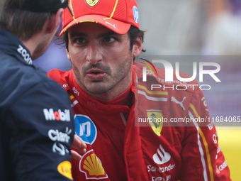 Max Verstappen and Carlos Sainz speak after finishing a sprint race at Circuit of the Americas in Austin, Texas, on October 19, 2024, during...