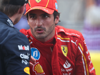 Max Verstappen and Carlos Sainz speak after finishing a sprint race at Circuit of the Americas in Austin, Texas, on October 19, 2024, during...