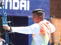 Priyansh of India competes against Prathamesh Balchandra Fuge of India (not in picture) during the quarterfinals match on the second day of...