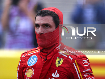 Carlos Sainz emerges from his car after winning a sprint race at Circuit of the Americas in Austin, Texas, on October 19, 2024, during the F...