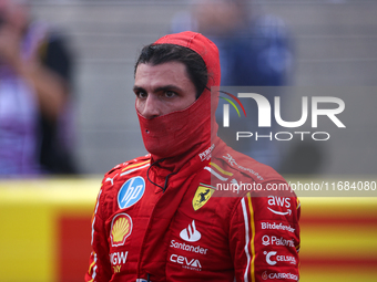 Carlos Sainz emerges from his car after winning a sprint race at Circuit of the Americas in Austin, Texas, on October 19, 2024, during the F...