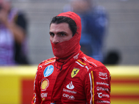 Carlos Sainz emerges from his car after winning a sprint race at Circuit of the Americas in Austin, Texas, on October 19, 2024, during the F...