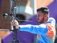 Prathamesh Balchandra Fuge of India competes against Priyansh of India (not in picture) during the quarterfinals match on the second day of...