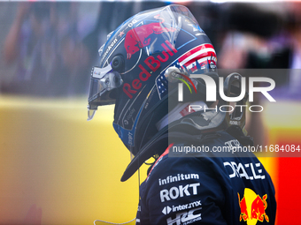 Max Verstappen emerges from his car after winning a sprint race at Circuit of the Americas in Austin, Texas, on October 19, 2024, during the...