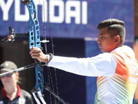 Priyansh of India competes against Prathamesh Balchandra Fuge of India (not in picture) during the quarterfinals match on the second day of...