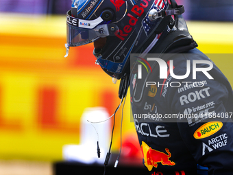 Max Verstappen emerges from his car after winning a sprint race at Circuit of the Americas in Austin, Texas, on October 19, 2024, during the...