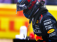 Max Verstappen emerges from his car after winning a sprint race at Circuit of the Americas in Austin, Texas, on October 19, 2024, during the...