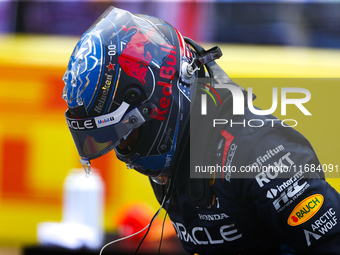 Max Verstappen emerges from his car after winning a sprint race at Circuit of the Americas in Austin, Texas, on October 19, 2024, during the...