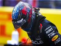 Max Verstappen emerges from his car after winning a sprint race at Circuit of the Americas in Austin, Texas, on October 19, 2024, during the...