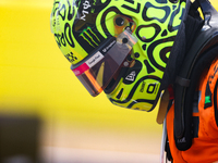 Lando Norris emerges from his car after winning a sprint race at Circuit of the Americas in Austin, Texas, on October 19, 2024, during the F...